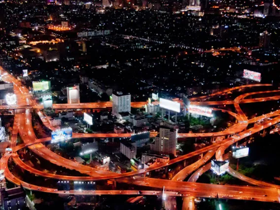 City at night, with roadways and exchanges lit up