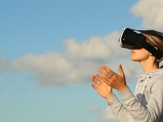 Person using a VR headset outdoors
