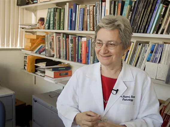 Scientist smiling for photo in her office