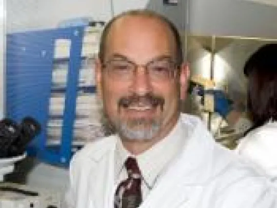 Photo of Scott Sherman, M.D., Ph.D. working in lab