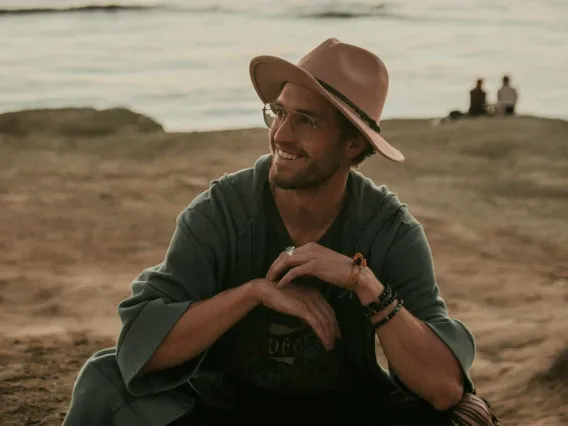 Reed Bjork posing for photo on a beach