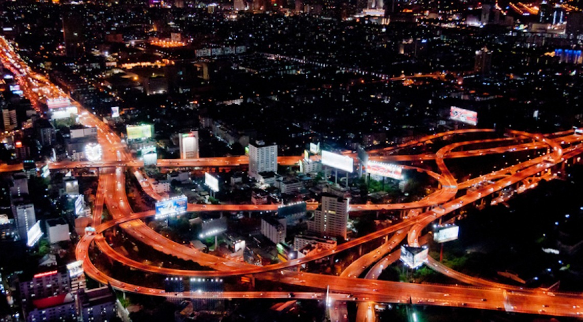City at night, with roadways and exchanges lit up