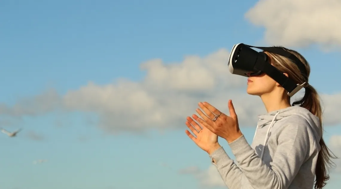 Person using a VR headset outdoors